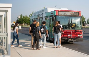 Students getting on a bus