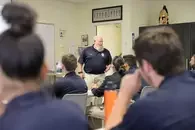 Forsman teaching his class