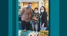 Three employees with masks on