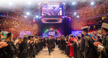 Confetti falling on graduates at the conclusion of the 2019 Commencement ceremony at Taco Bell Arena on May 17, 2019