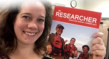 Rebecca Flock holding Idaho NSF-EPSCoR Summer 2017 Newsletter