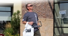 CWI employee with #mightyCWI gear