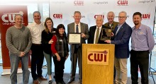 CWI staff members and Trustees pose with Gov. Brad Little during awards presentation