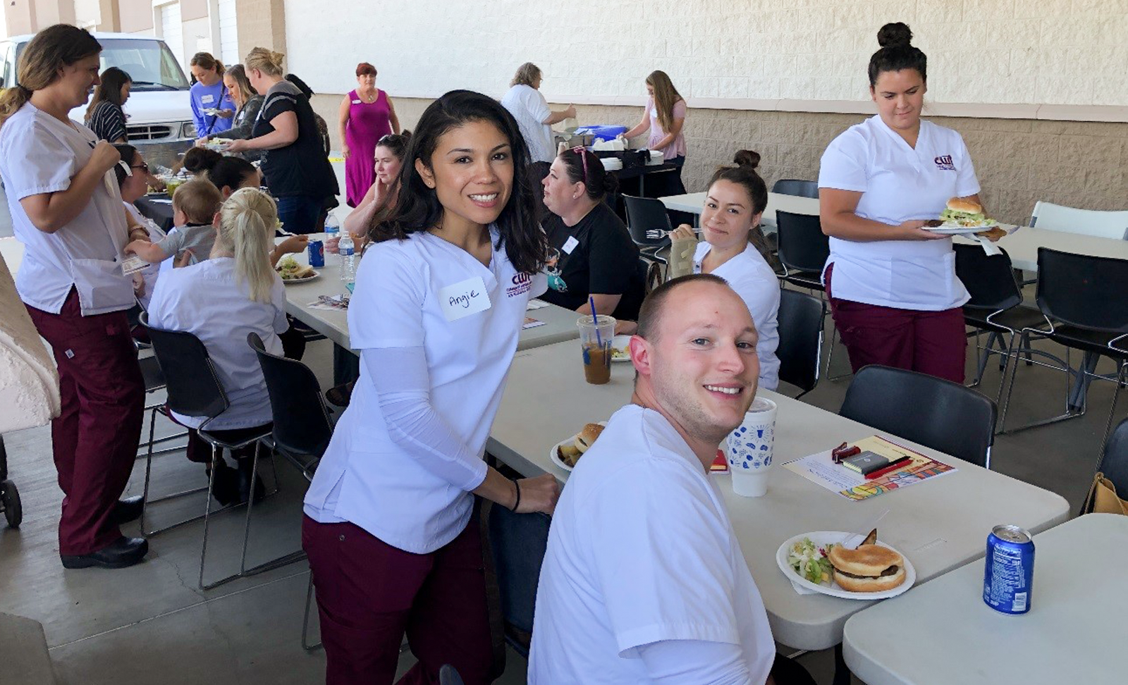 Students attending a barbecue hosted by Saint Alphonsus Aug. 27, 2019