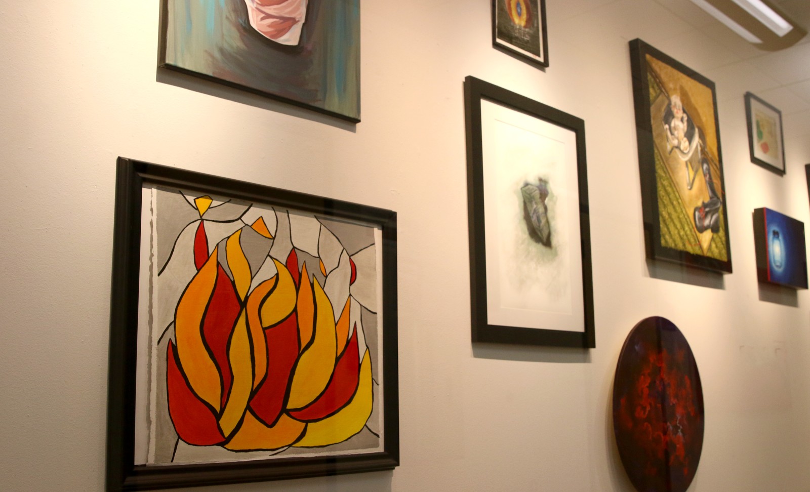 Paintings displayed in the Art Studio Gallery located at the Nampa Campus Academic Building