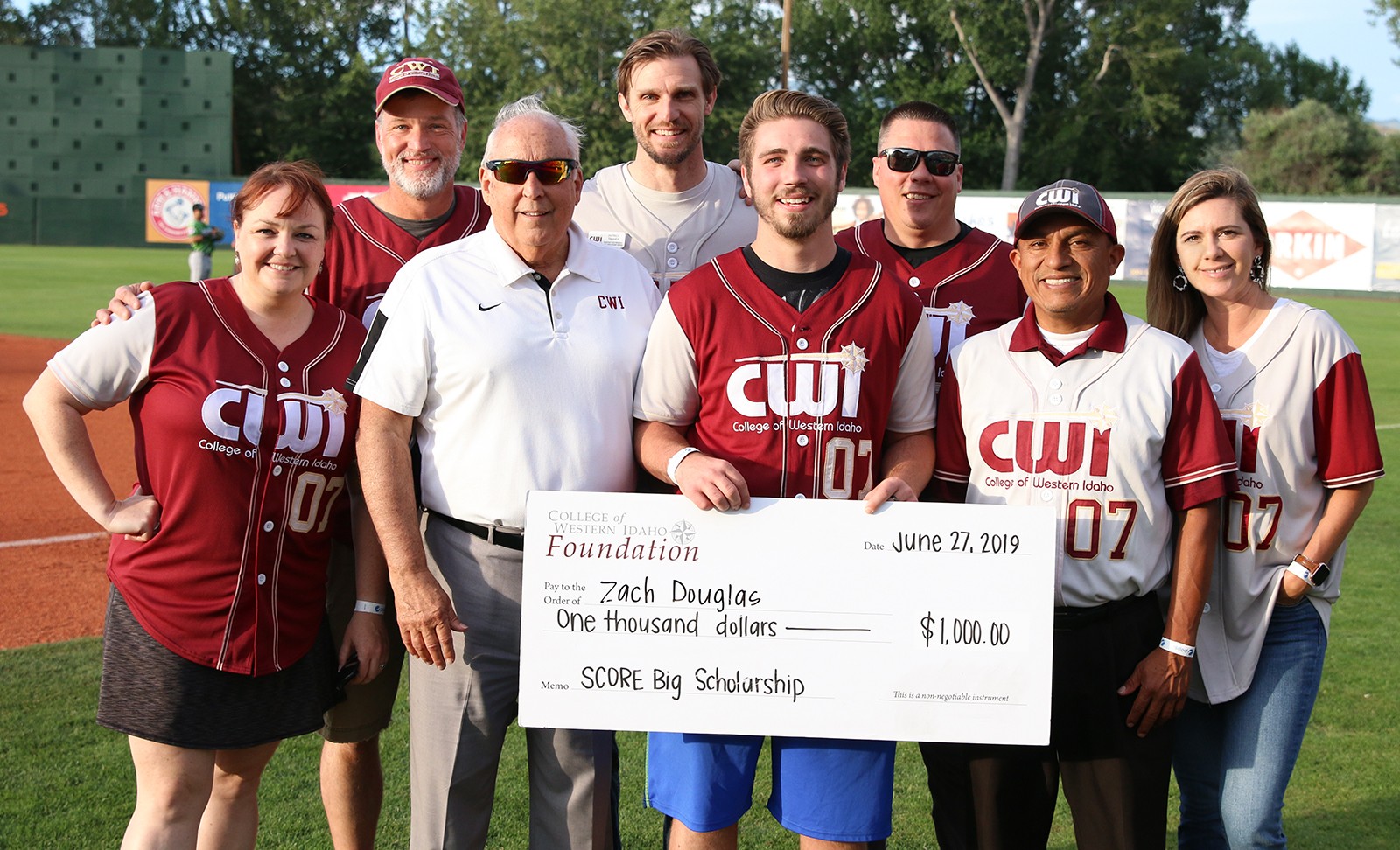 Zach Douglas receives a SCORE Big Scholarship at CWI Night at the Boise Hawks