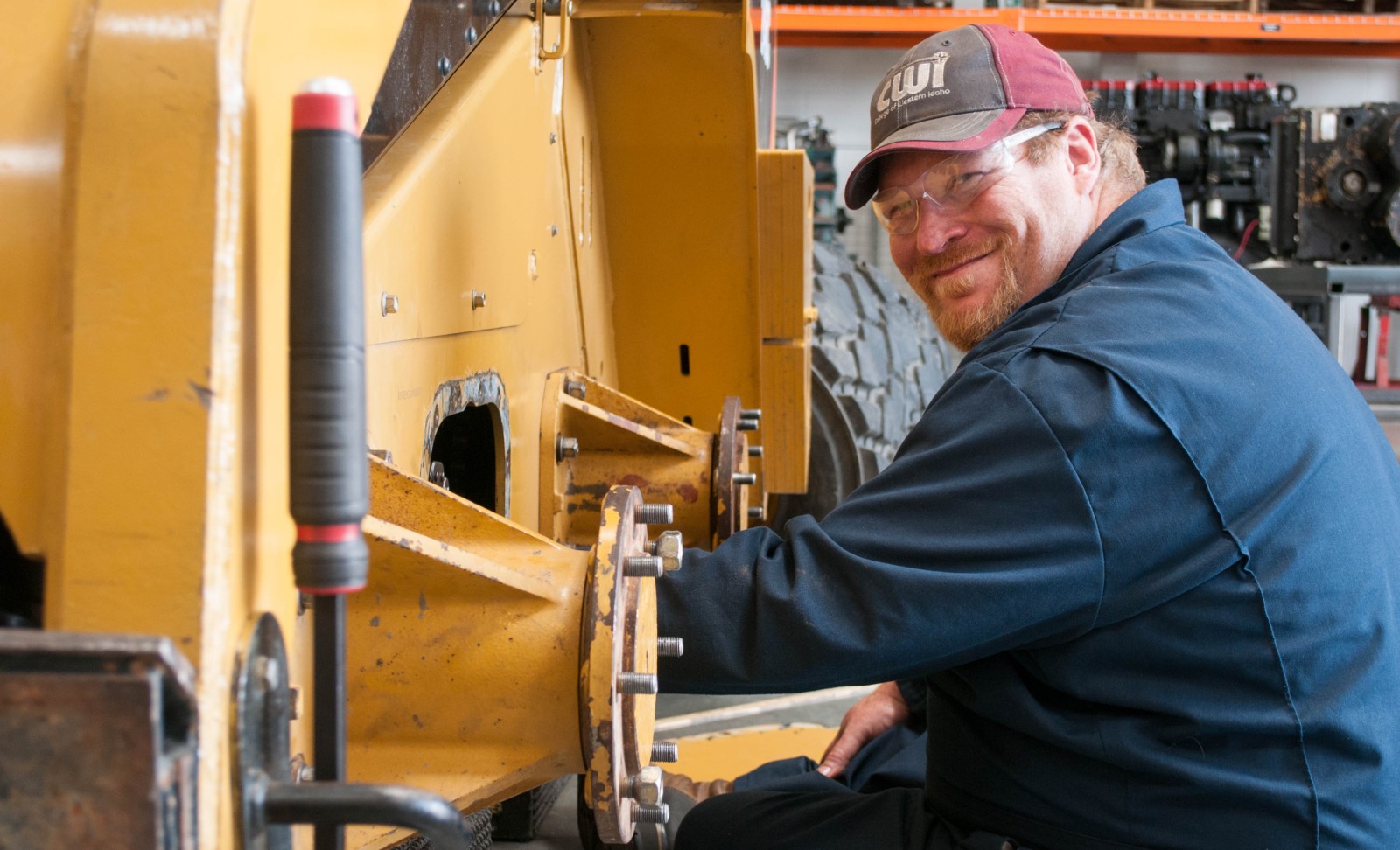CWI Heavy Equipment student working on a skid steer