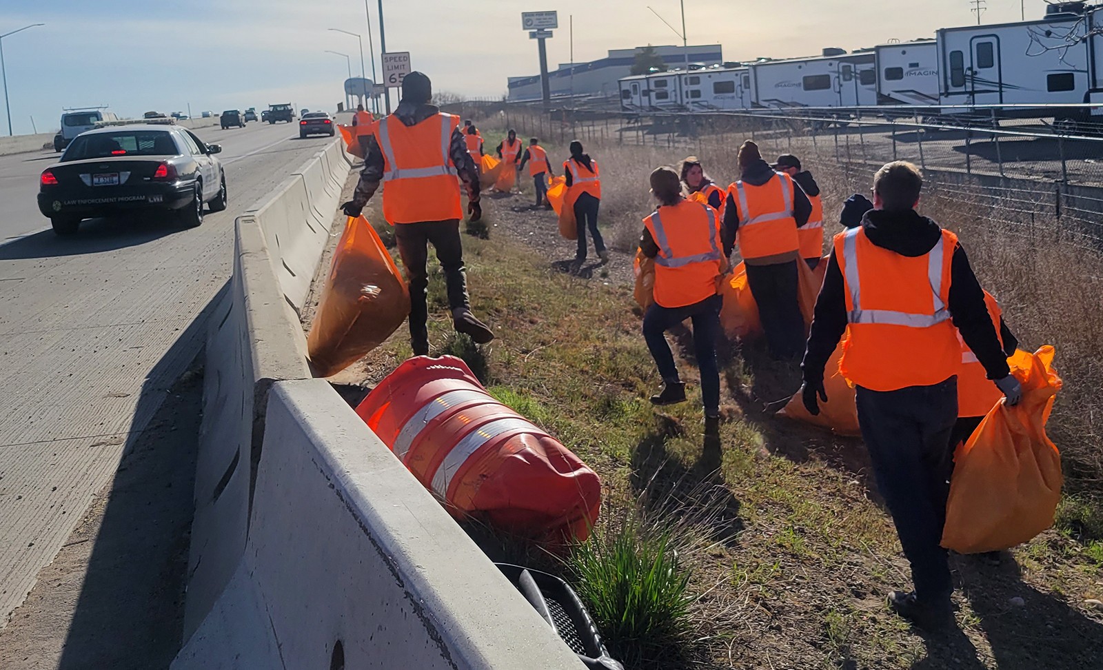Law Enforcement students picking up trash along Interstate 84