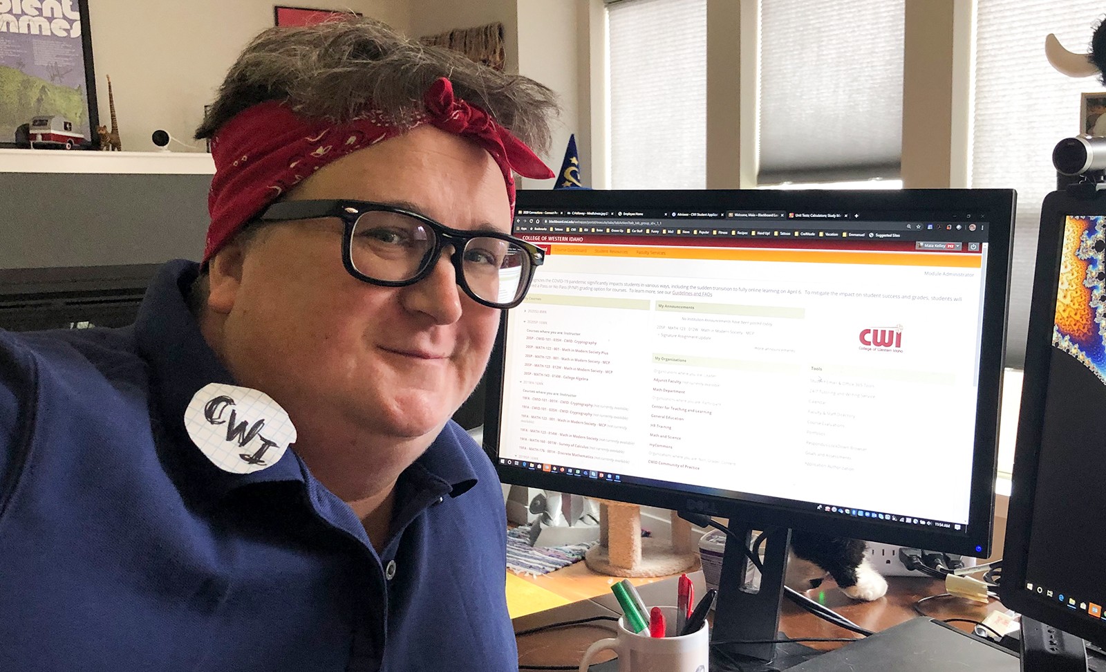 Maia Kelley, Assistant Professor of Math, working from home dressed as Rosie the Riveter