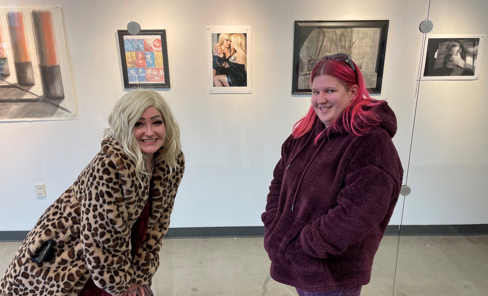 2022 Juried Art Exhibition winner, Christy Runion, right, alongside the model for her photography submission on display at the N