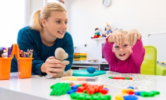 Occupational therapy assistant working with a child
