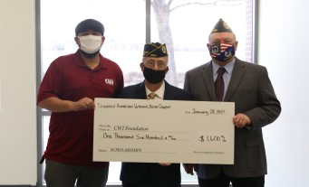 Ivan Castillo accepting a donation to the CWI Foundation from the Disabled American Veterans Chapter 2 Boise