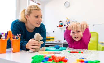 Occupational therapy assistant working with a child