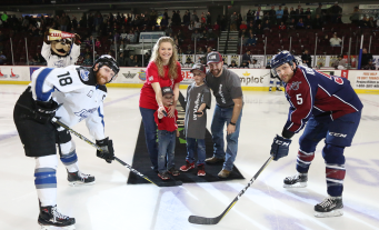 Puck drop by Tinker Family on the ice during CWI Night at the Idaho Steelheads