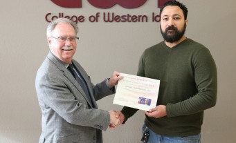 Daniel VanRenselaar, a veteran and Business major at College of Western Idaho, receives John McCain Memorial Award