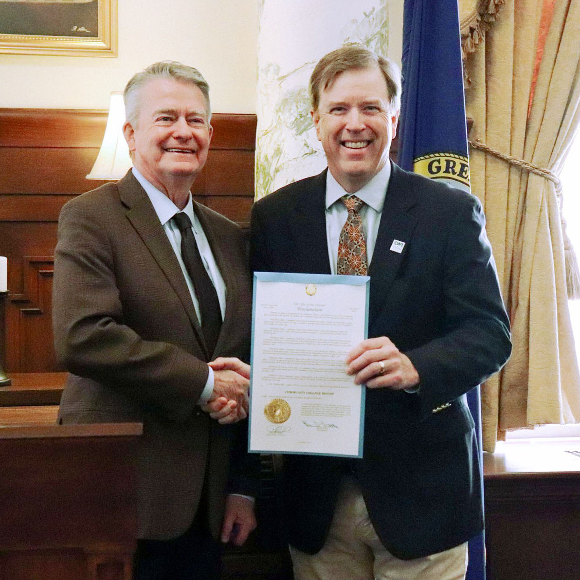 CWI President Gordon Jones shakes the hand of Idaho Governor Brad Little after being presented with a ceremonial proclamation. 