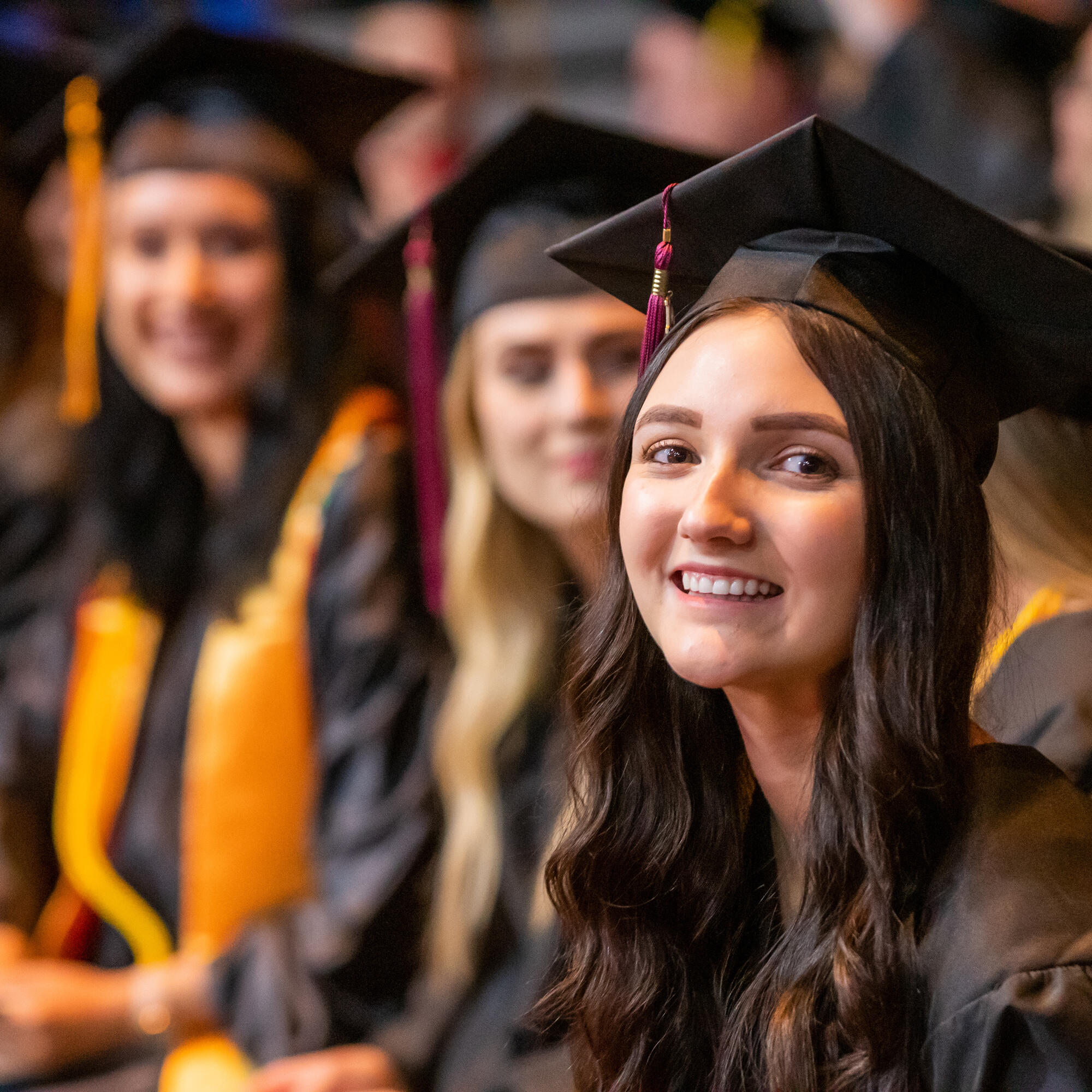 Students in caps and gowns at graduation