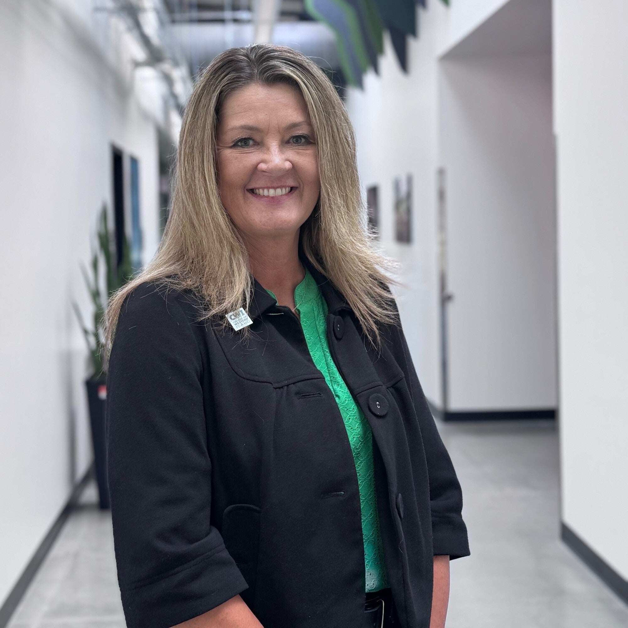 Audrey Eldridge standing in hallway 