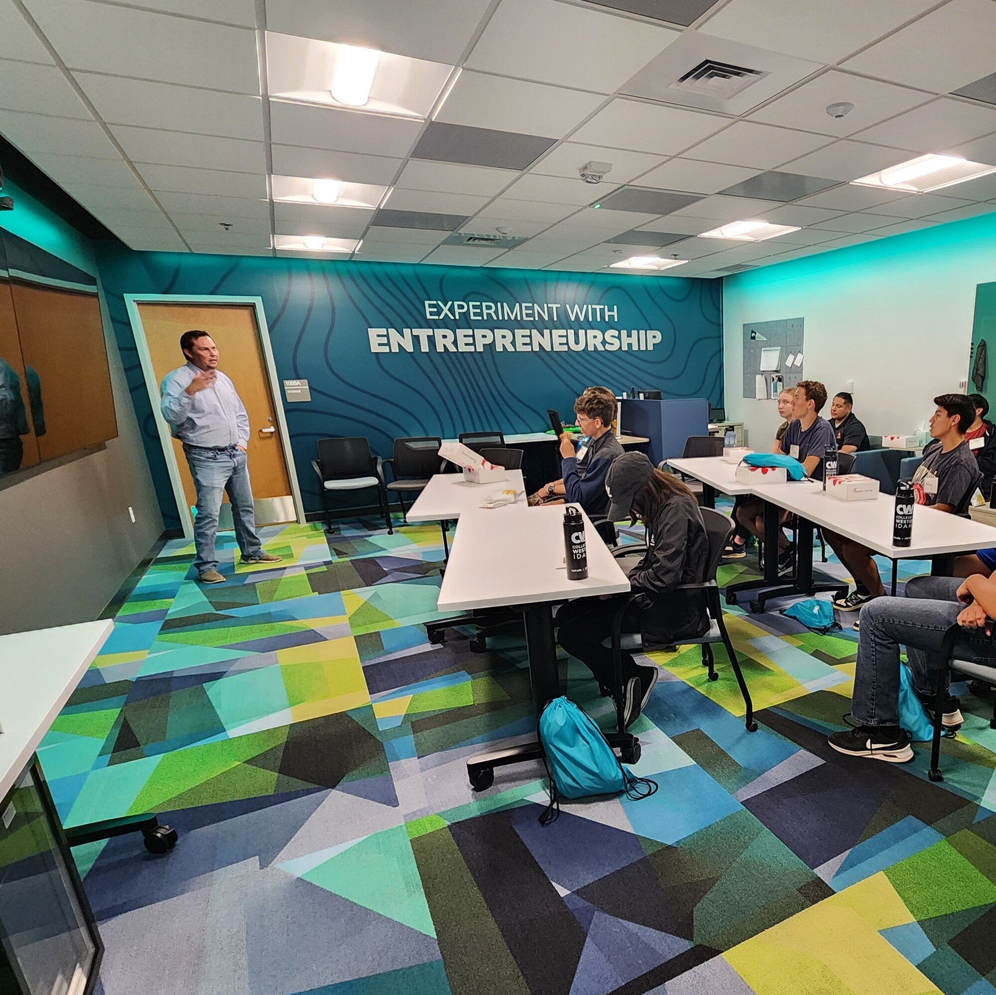 Students listen to a presentation in an Entrepreneur Lab.