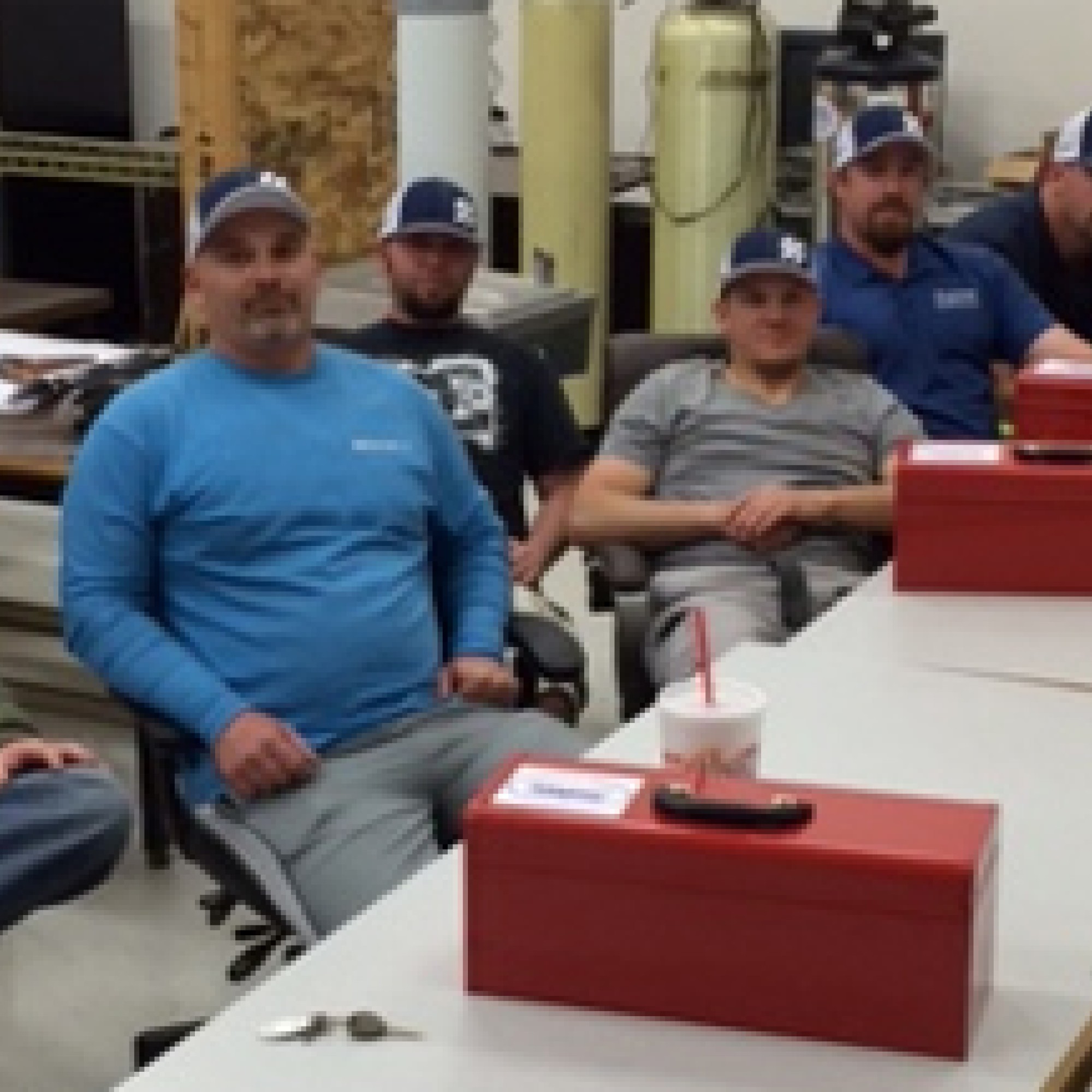 Plumbing Apprentices sitting at tables in a classroom