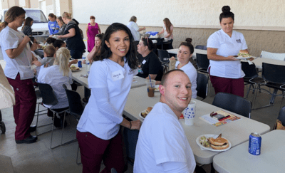 Students attending a barbecue hosted by Saint Alphonsus Aug. 27, 2019