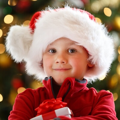 Child wearing a Santa ht