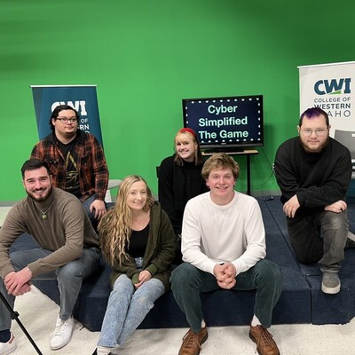 CWI Multimedia class sitting in front of game show set