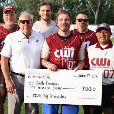 Zach Douglas receives a SCORE Big Scholarship at CWI Night at the Boise Hawks