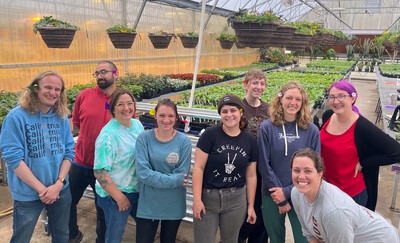 Horticulture students in a greenhouse