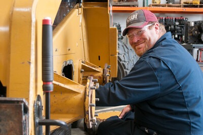 CWI Heavy Equipment student working on a skid steer
