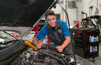 CWI Automotive Technology student working on a car in the lab