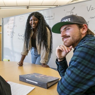 Students working together near whiteboard