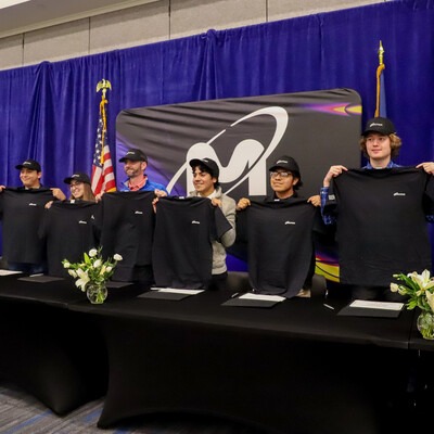 Micron Apprentices holding up t-shirts for signing day