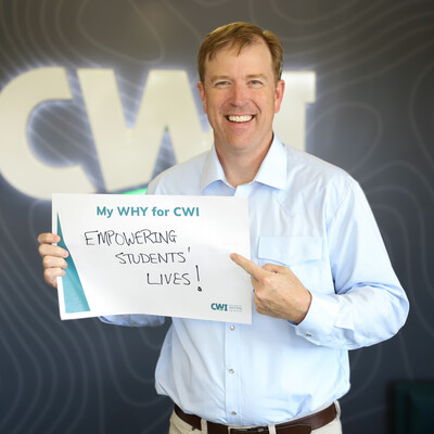 President Gordon Jones holding a sign that says "My WHY for CWI - Empowering Students' Lives!"