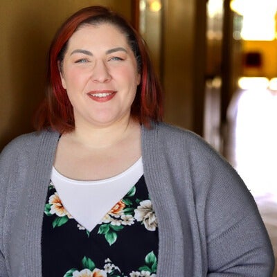 Kari Meyers standing at a wall