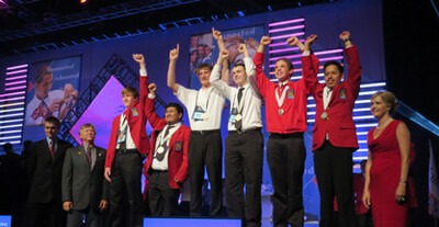 Carlos Gonzales (right) celebrates his silver medal on the podium.