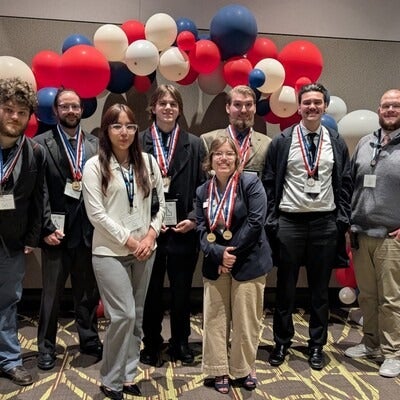 Group of students displaying medals