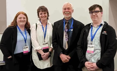 CWI students, Kylee Malouf, left, Mercedes Nelson, and Timothy Buckles with world-renowned social psychologist, Roy Baumeister. 
