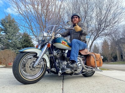 Reggie Jayne, Associate Professor of History, on a motorcycle