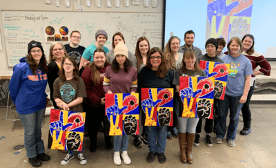 Students with Visiting Artist, Nancy Rourke, during a hands-on paint workshop Feb. 20. 