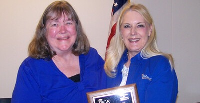 Shannon Chapman (left) is presented the Chapter Service Award.