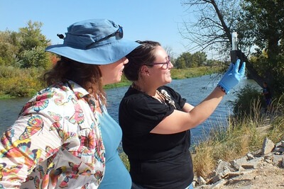 Watershed Watch participants testing water quality