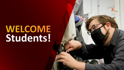 Welcome, students! Student wearing a mask working in a CTE lab