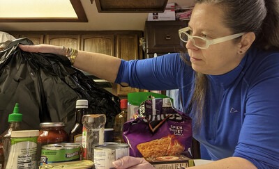 Liz Otterness throwing away food at her home that contain sugar