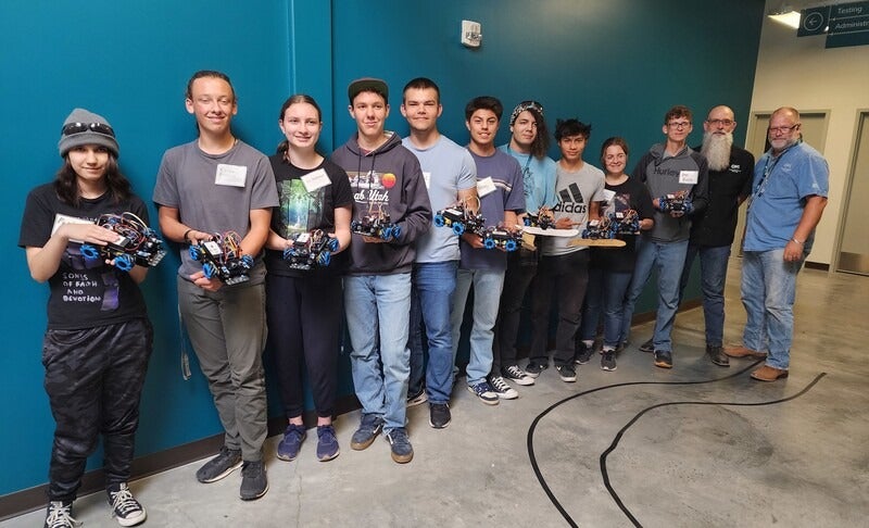 Group of students posing for a photo looking at the camera