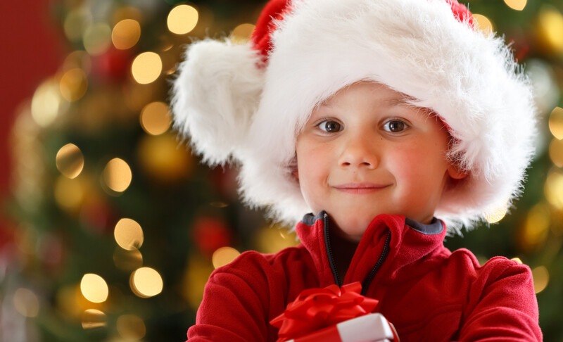 Child wearing a Santa ht