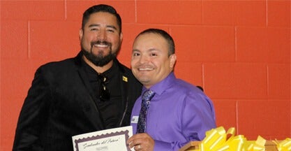 Luis Caloca with recognition certificate