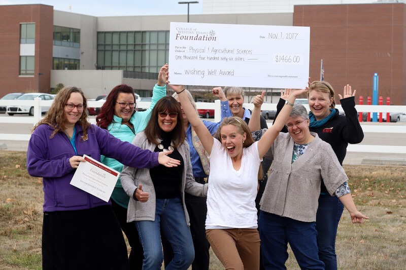 Wishing Well Fund recipients group shot with giant check