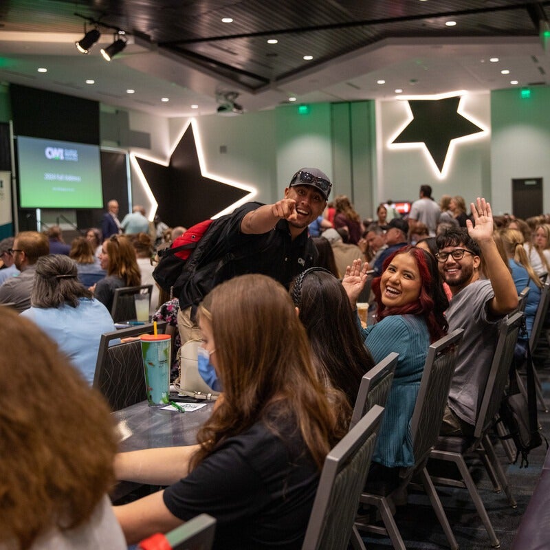 CWI Employees smiling and looking at the camera at an event