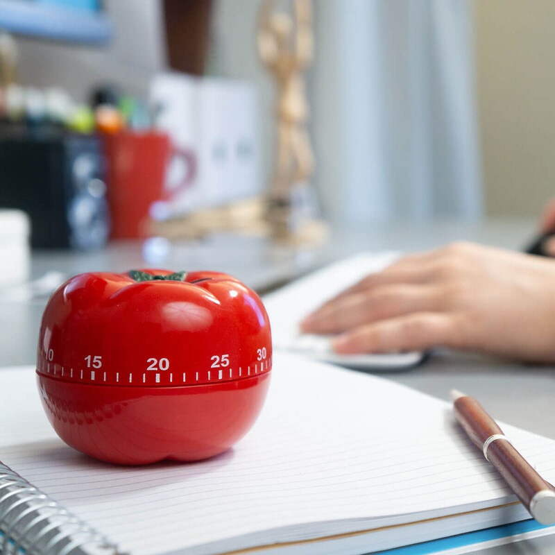 Image features a student using a tomato timer to set a block of focus time.